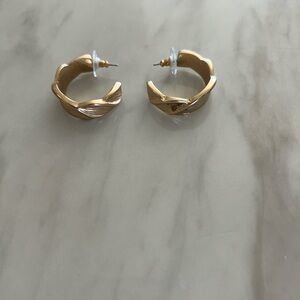 Gold hoop earrings with a unique design excellent quality.